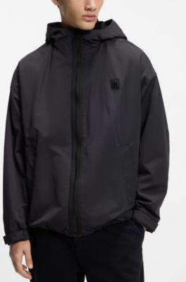 Water-repellent hooded windbreaker with stacked-logo badge, Black
