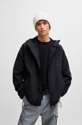 Water-repellent hooded windbreaker with stacked-logo badge, Black