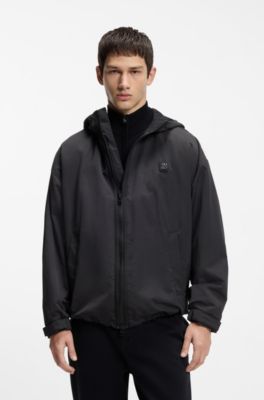 Water-repellent hooded windbreaker with stacked-logo badge, Black