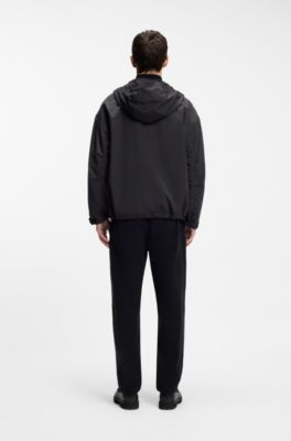 Water-repellent hooded windbreaker with stacked-logo badge, Black