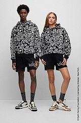 Genderneutraler BOSS x Keith Haring Hoodie aus Baumwolle mit speziellem Artwork, Schwarz gemustert