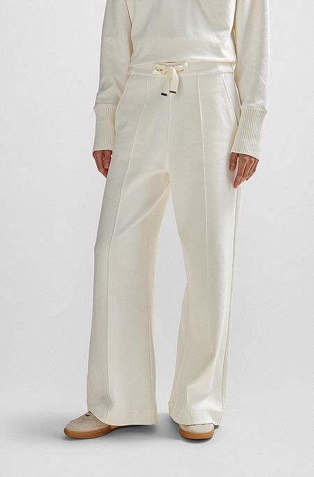 Pantalones tapered fit de algodón con cordón en la cintura y ribetes de cinta, Blanco