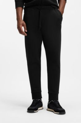 Stretch-cotton tracksuit bottoms with logo print, Black