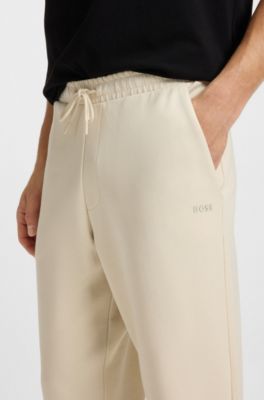 Bas de surv&ecirc;tement en coton stretch avec logo imprim&eacute;, Naturel