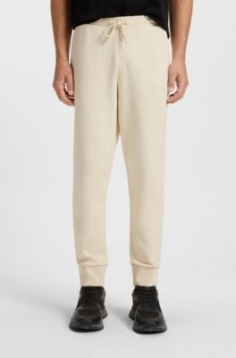 Bas de surv&ecirc;tement en coton stretch avec logo imprim&eacute;, Naturel
