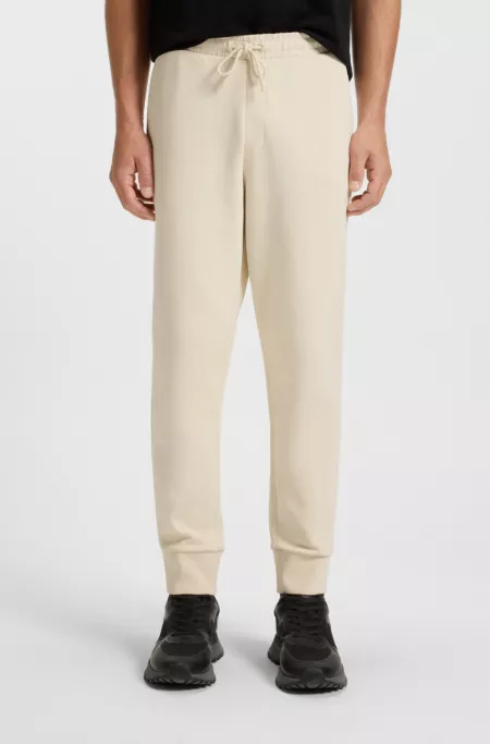 Stretch-cotton tracksuit bottoms with logo print