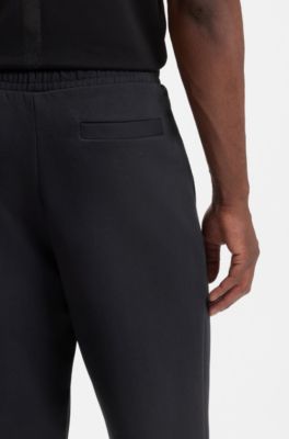 Pantalones de ch&aacute;ndal en algod&oacute;n el&aacute;stico con logo estampado, Azul oscuro