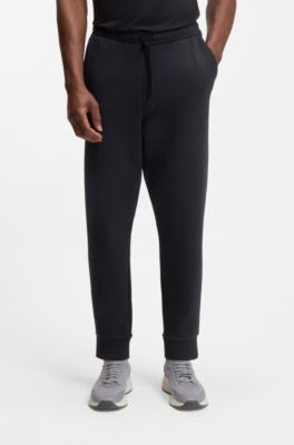 Pantalones de ch&aacute;ndal en algod&oacute;n el&aacute;stico con logo estampado, Azul oscuro