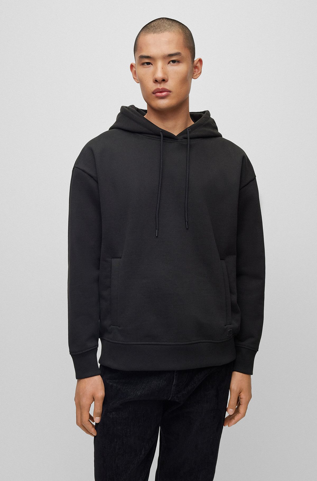Relaxed-fit hoodie in French terry with logo badge, Black