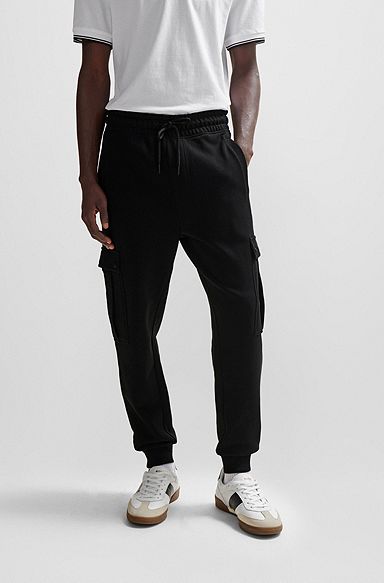 Cotton-terry tracksuit bottoms with cargo pockets, Black