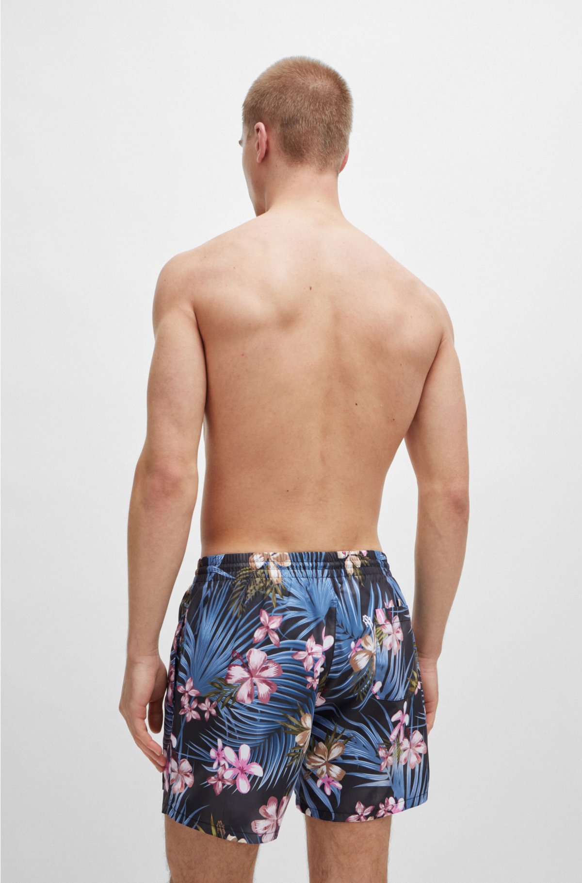 Tropical-print quick-drying swim shorts with logo badge, Black
