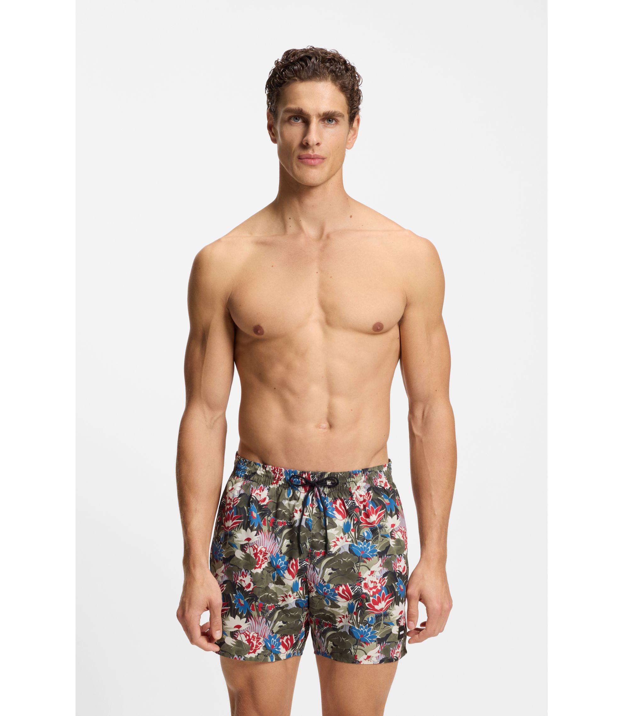 Badeshorts mit Allover-Print und Logo-Badge