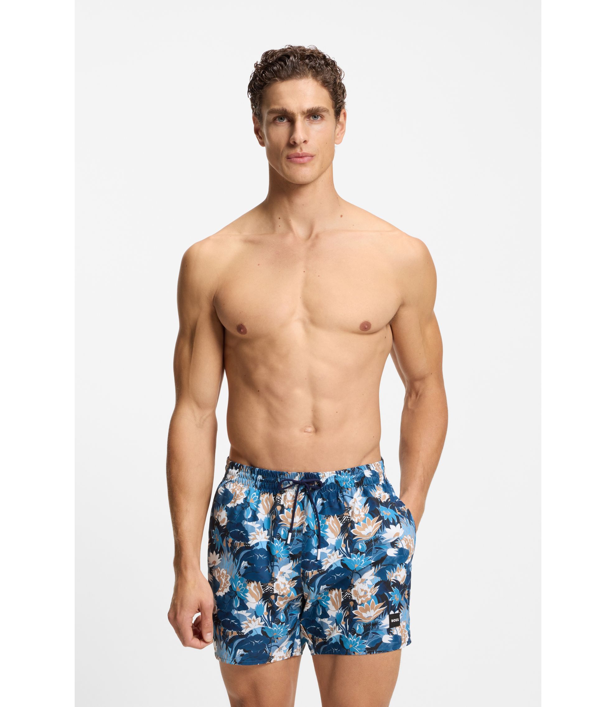 Badeshorts mit Allover-Print und Logo-Badge