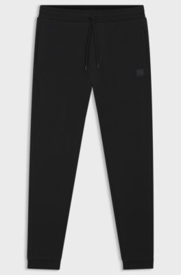 Cotton-terry tracksuit bottoms with logo patch, Black