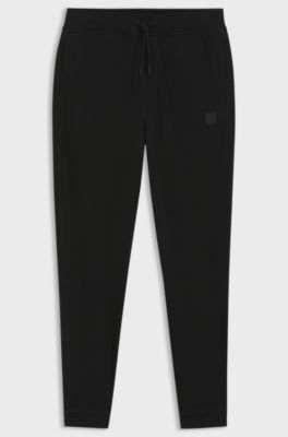 Cotton-terry tracksuit bottoms with logo patch, Black