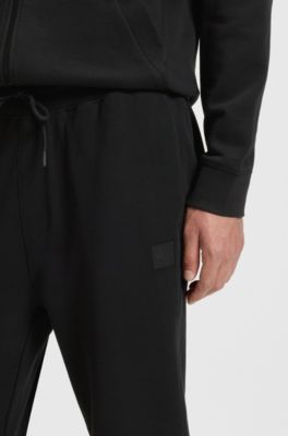 Cotton-terry tracksuit bottoms with logo patch, Black