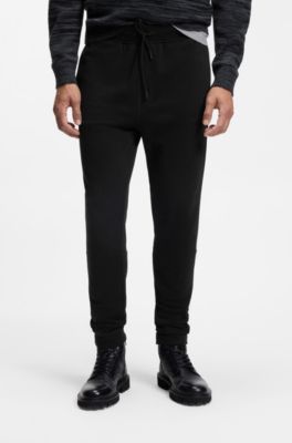 Cotton-terry tracksuit bottoms with logo patch, Black