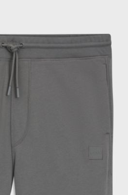 Cotton-terry tracksuit bottoms with logo patch, Grey