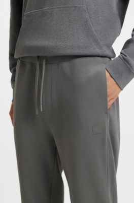 Cotton-terry tracksuit bottoms with logo patch, Grey