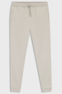 Cotton-terry tracksuit bottoms with logo patch, Light Grey