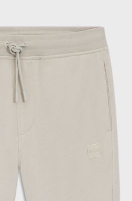 Cotton-terry tracksuit bottoms with logo patch, Light Grey