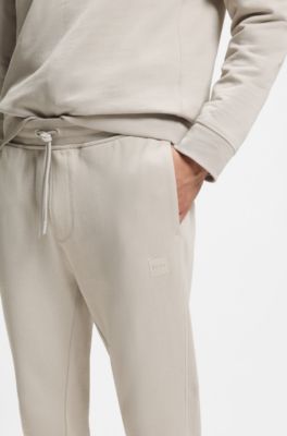 Pantaloni della tuta in terry di cotone con toppa con logo, Grigio chiaro