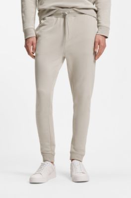 Bas de surv&ecirc;tement en molleton de coton avec patch logo, Gris chin&eacute;