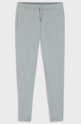 Jogginghose aus Baumwoll-Terry mit Logo-Aufn&auml;her, Hellgrau