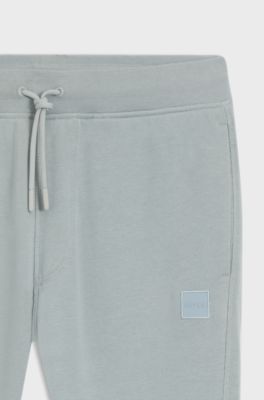 Pantaloni della tuta in terry di cotone con toppa con logo, Grigio chiaro