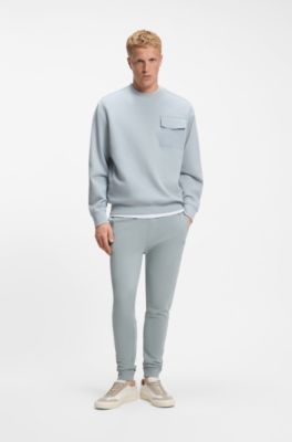 Jogginghose aus Baumwoll-Terry mit Logo-Aufn&auml;her, Hellgrau