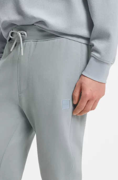 Cotton-terry tracksuit bottoms with logo patch