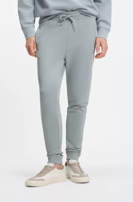 Cotton-terry tracksuit bottoms with logo patch