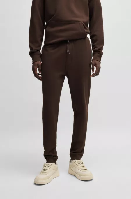 Cotton-terry tracksuit bottoms with logo patch