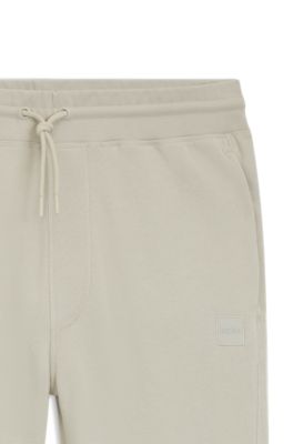 Cotton-terry tracksuit bottoms with logo patch, Light Beige