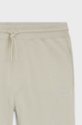 Cotton-terry tracksuit bottoms with logo patch, Light Beige