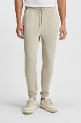 Cotton-terry tracksuit bottoms with logo patch, Light Beige