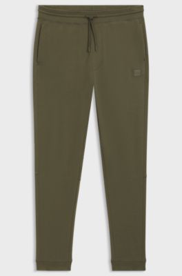 Jogginghose aus Baumwoll-Terry mit Logo-Aufn&auml;her, Olive