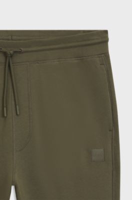 Cotton-terry tracksuit bottoms with logo patch, Olive