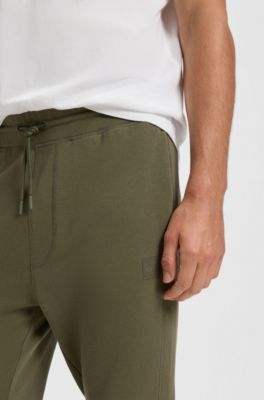 Cotton-terry tracksuit bottoms with logo patch, Olive