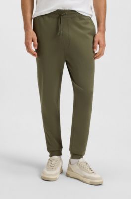 Cotton-terry tracksuit bottoms with logo patch, Olive