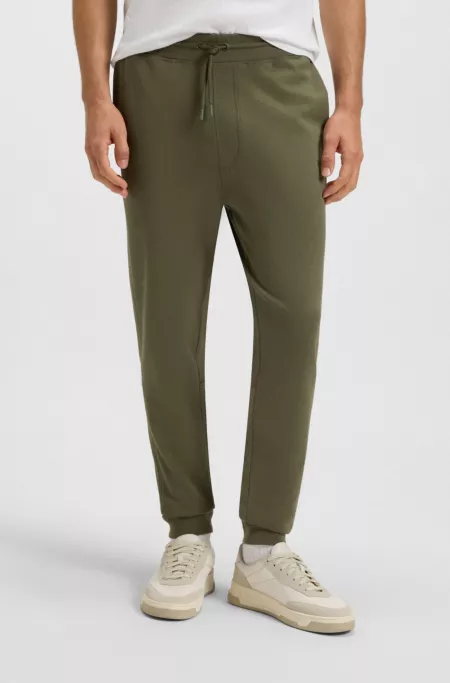 Cotton-terry tracksuit bottoms with logo patch