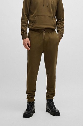 Cotton-terry tracksuit bottoms with logo patch, Brown