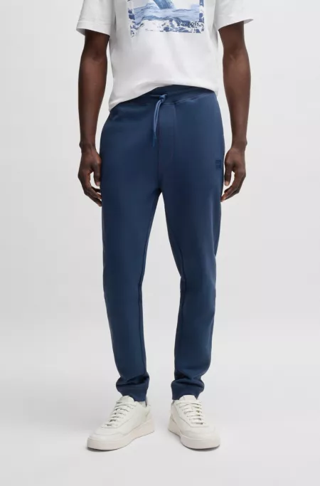 Cotton-terry tracksuit bottoms with logo patch