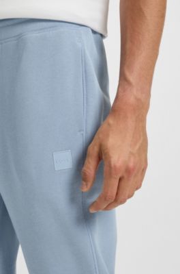 Cotton-terry tracksuit bottoms with logo patch, Light Blue
