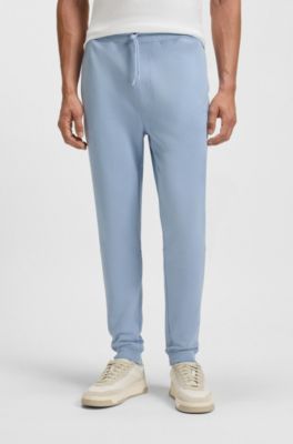 Cotton-terry tracksuit bottoms with logo patch, Light Blue