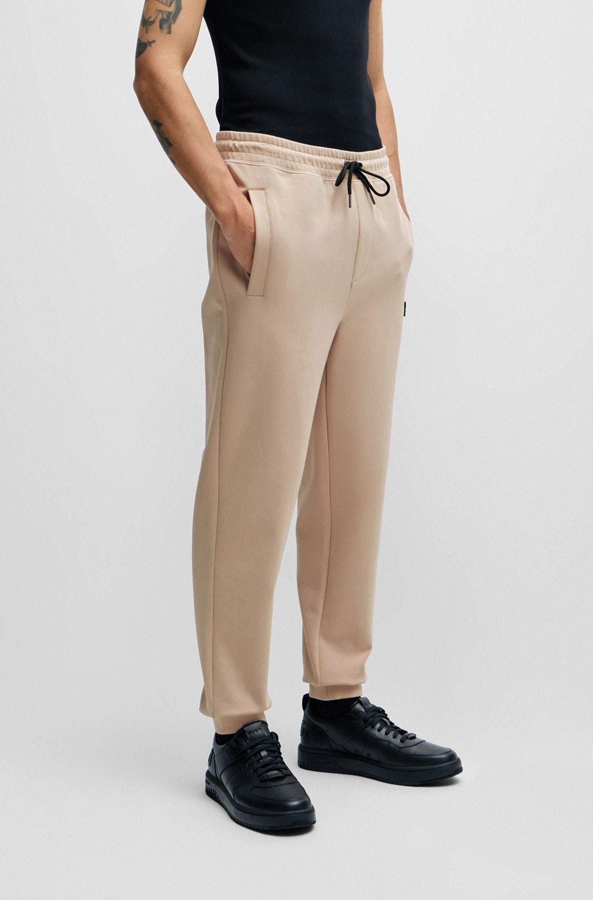 Stretch-cotton tracksuit bottoms with stacked logo, Beige