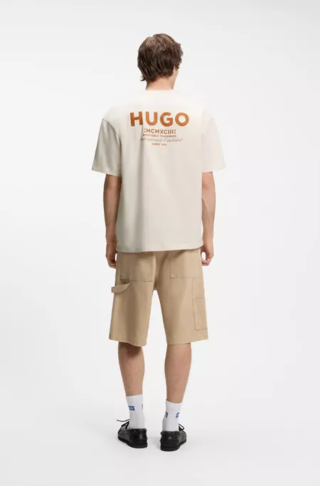 Loose-fit T-shirt in cotton with rear logo artwork