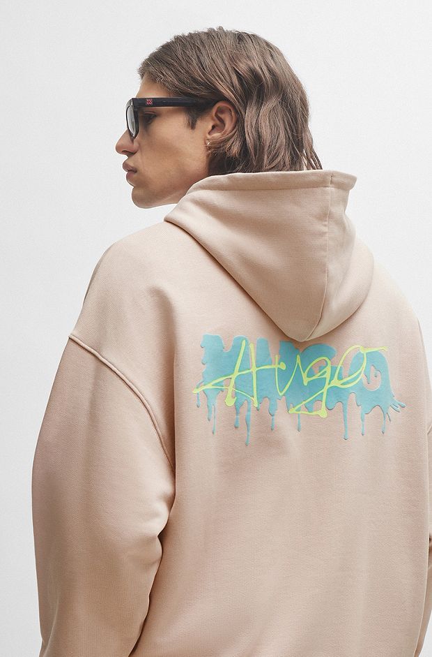Cotton-terry oversized-fit hoodie with seasonal logos, light pink