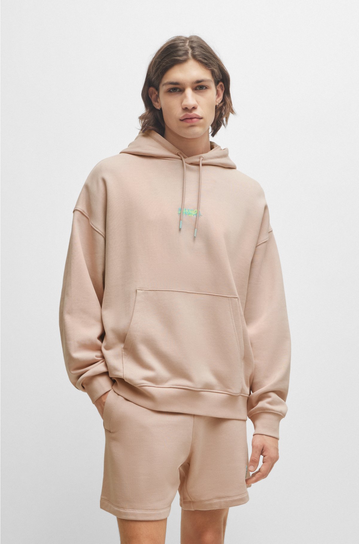 Cotton-terry oversized-fit hoodie with seasonal logos, light pink