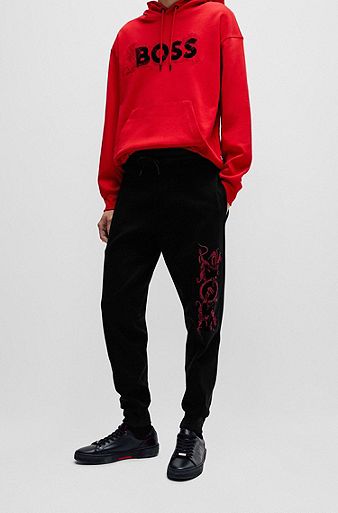 Interlock-cotton tracksuit bottoms with embroidered and printed logo, Black